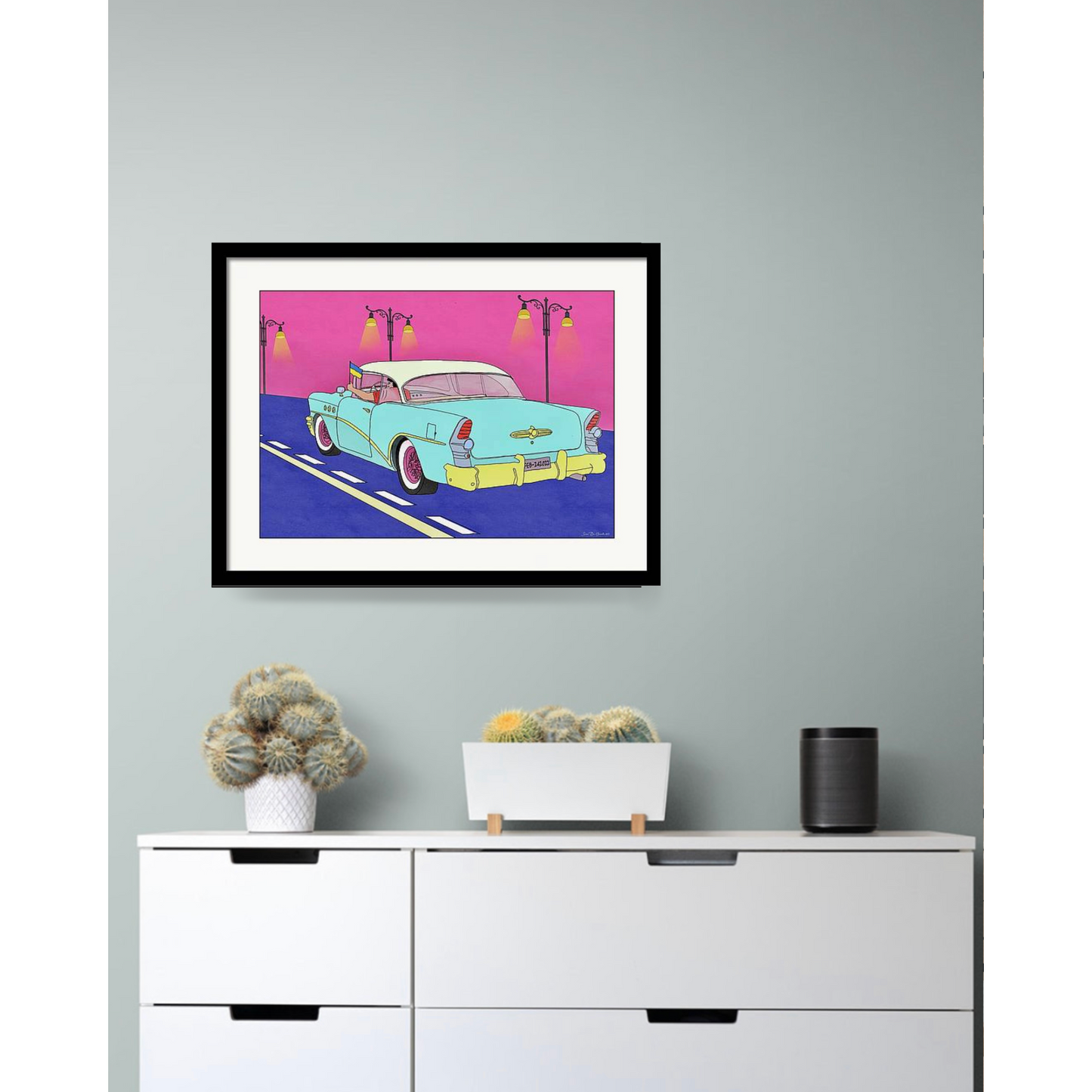 Cadillac på vegg med sort ramme