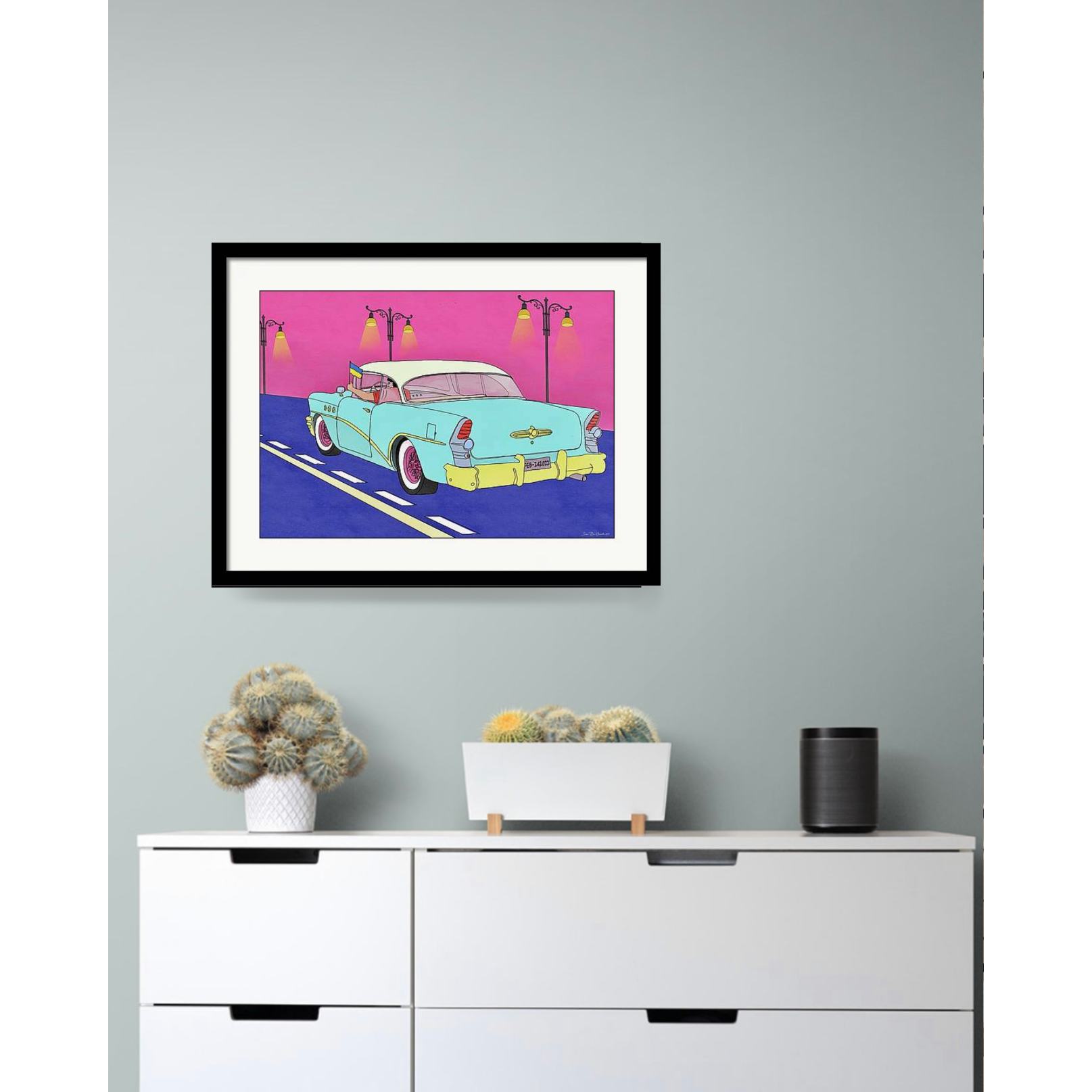 Cadillac på vegg med sort ramme