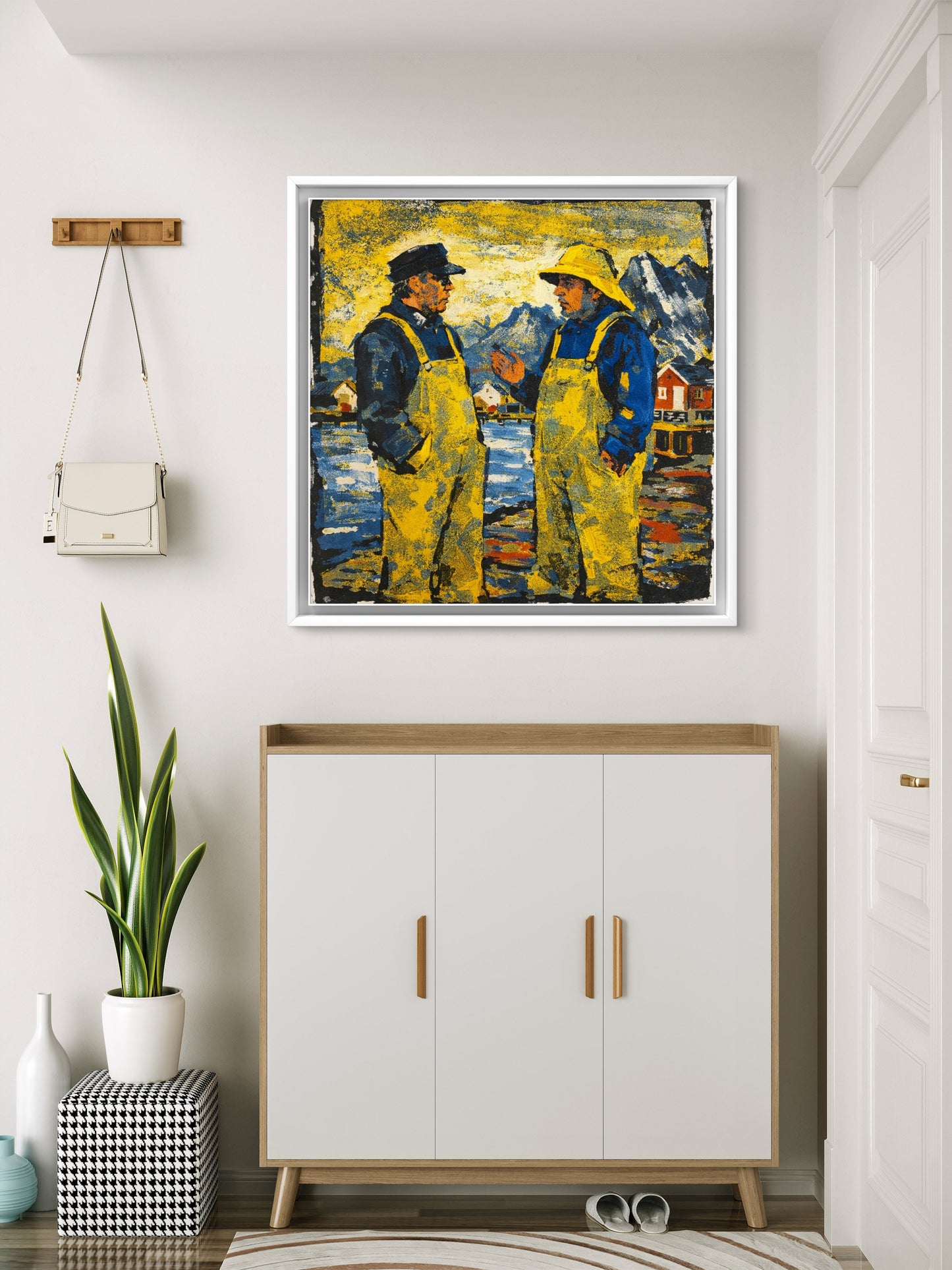 Bildet henger i gangen over en skokommode