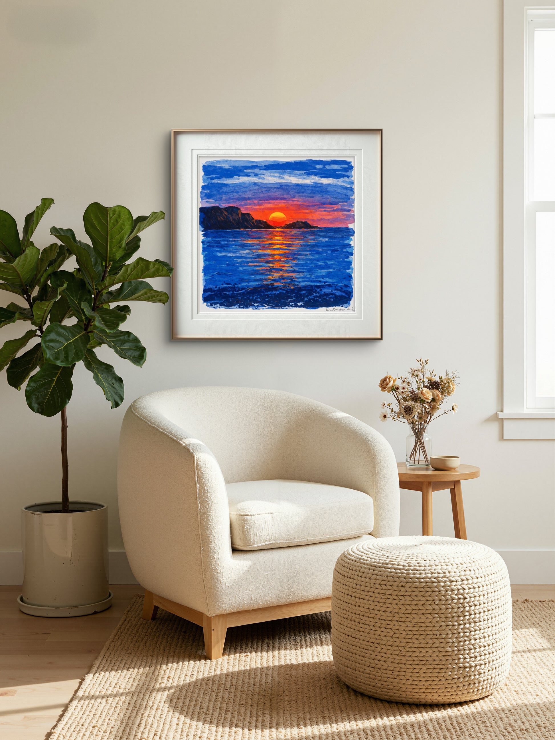 Solen dykker i havet på vegg over stol 