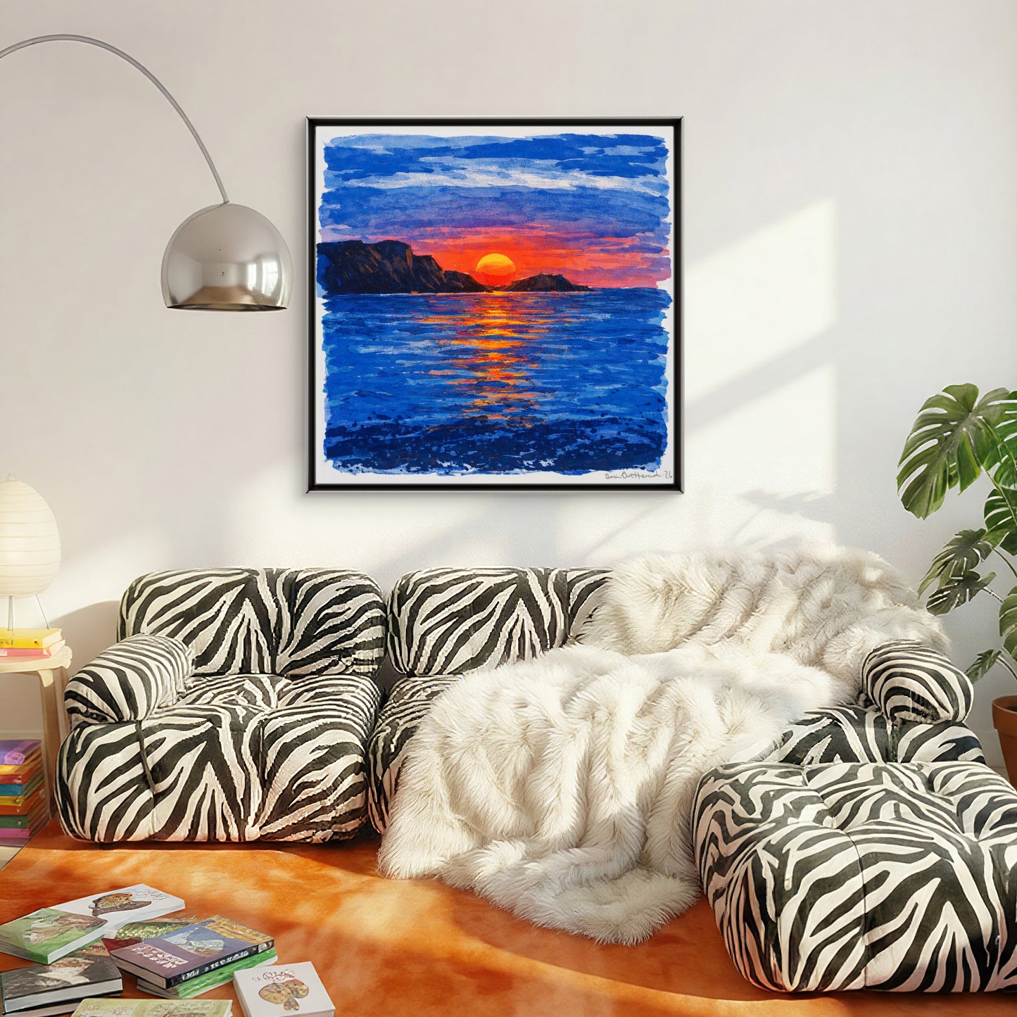 Sola dykker i havet over sebra sofa