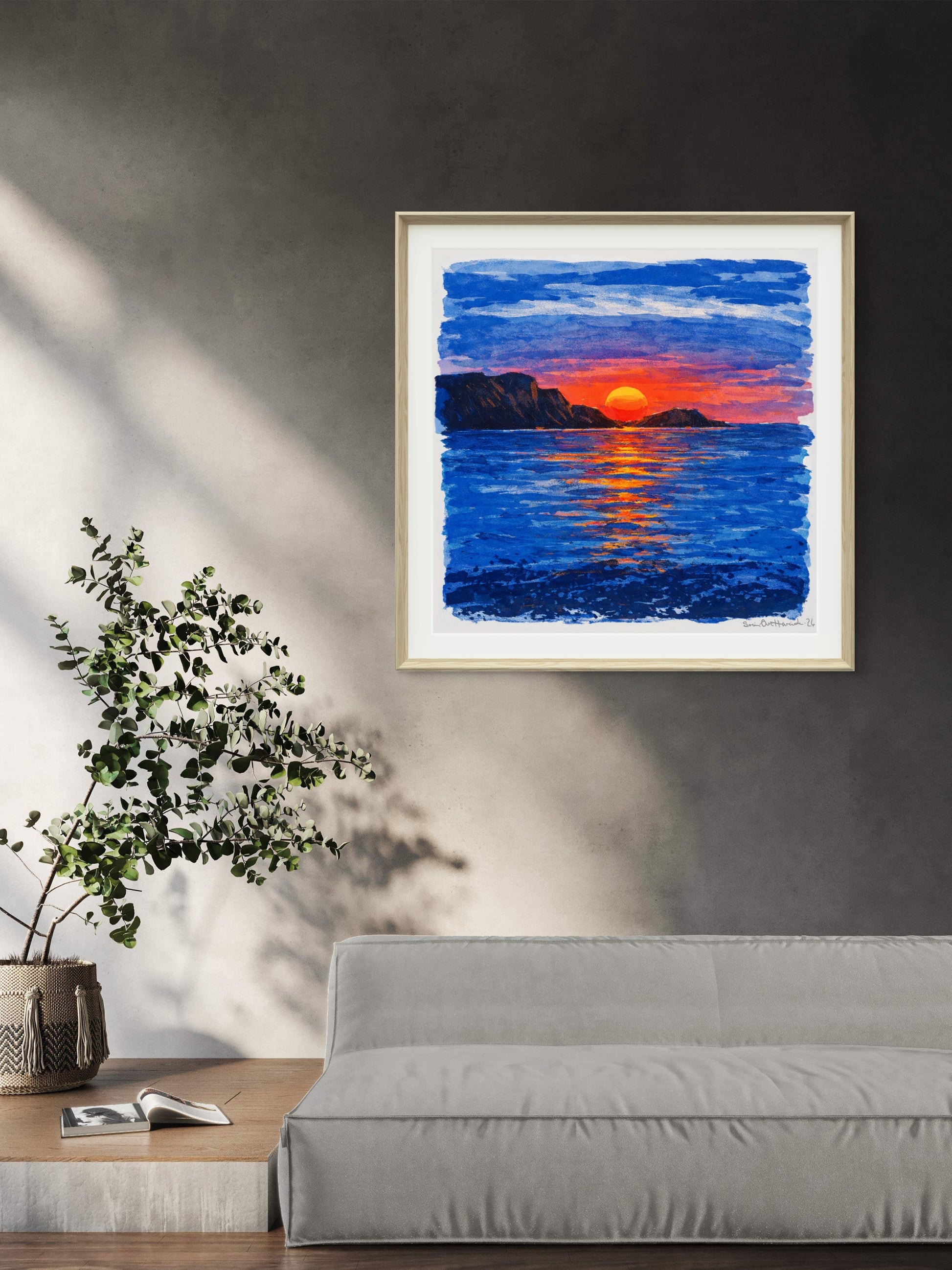 En rød sol over sofa lys ramme